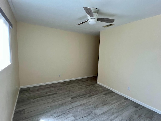 3330 Virginia St, Atwater, CA 95301 - spare room featuring dark wood finished floors, ceiling fan, plenty of natural light, and visible vents