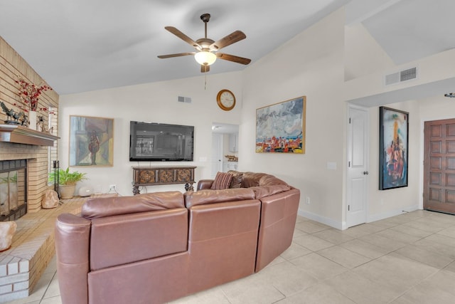 living room with ceiling fan, a fireplace, visible vents, and high vaulted ceiling