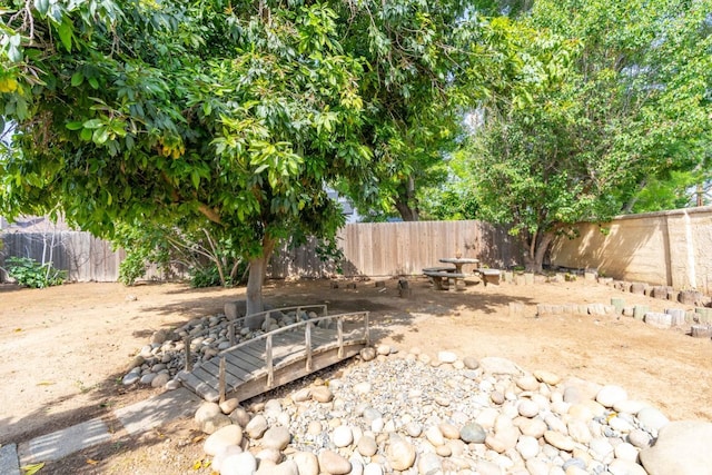view of yard with a fenced backyard
