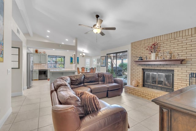 living room with a healthy amount of sunlight, ceiling fan, and light tile patterned floors