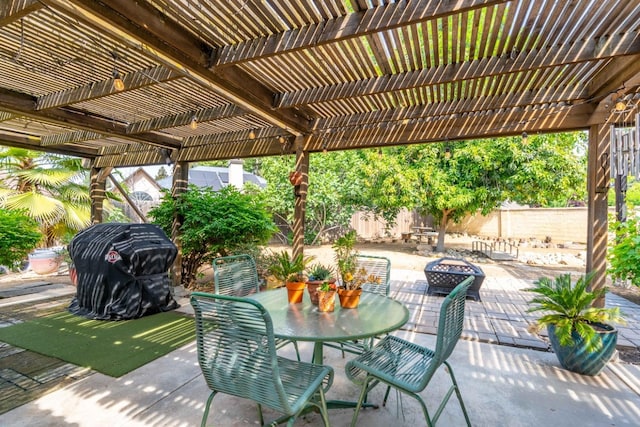 view of patio / terrace featuring a fenced backyard, a pergola, and area for grilling