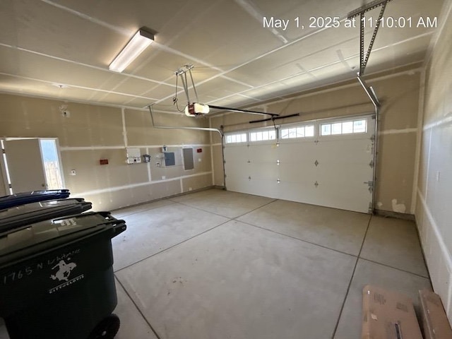 1765 N Whitmore, Clovis, CA 93619 - garage with electric panel and a garage door opener