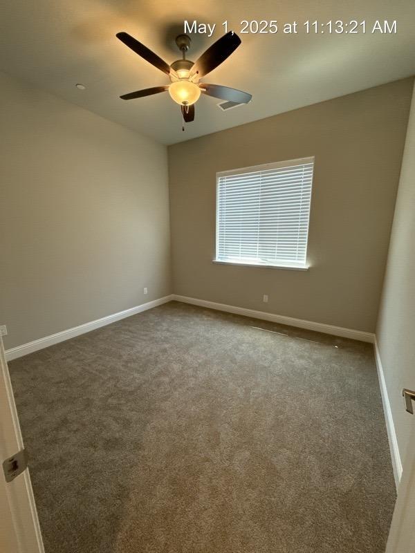 1765 N Whitmore, Clovis, CA 93619 - spare room featuring baseboards, a ceiling fan, and carpet floors