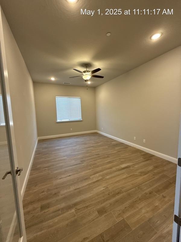 1765 N Whitmore, Clovis, CA 93619 - empty room featuring ceiling fan, recessed lighting, baseboards, and wood finished floors