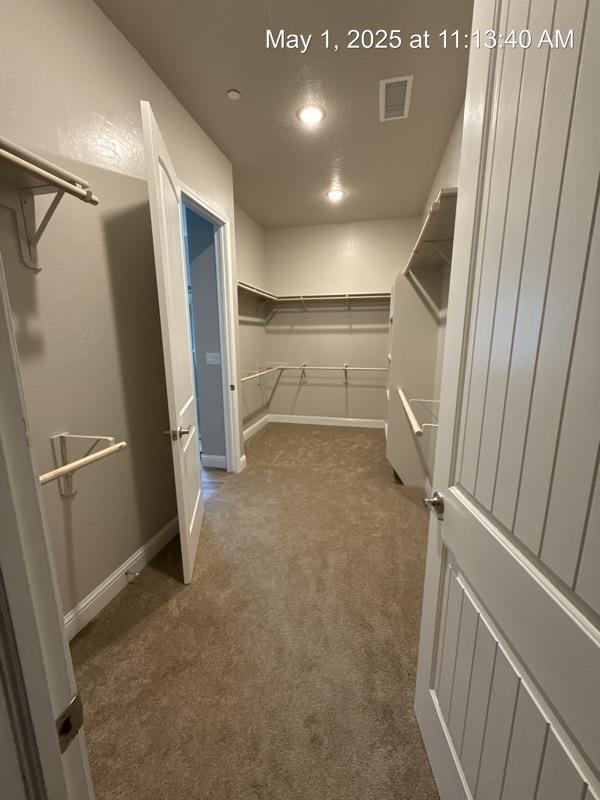 1765 N Whitmore, Clovis, CA 93619 - spacious closet featuring visible vents and carpet floors