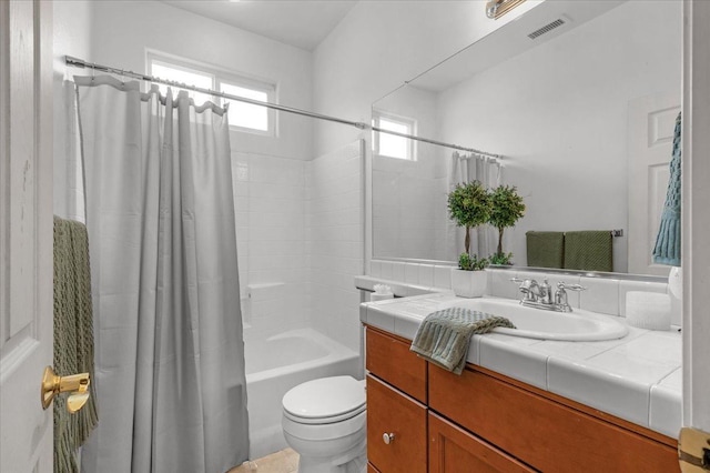 full bath with vanity, toilet, visible vents, and shower / bath combination with curtain