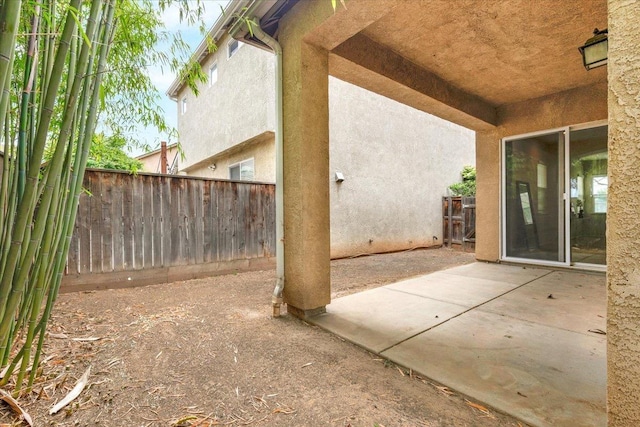 view of patio / terrace featuring fence