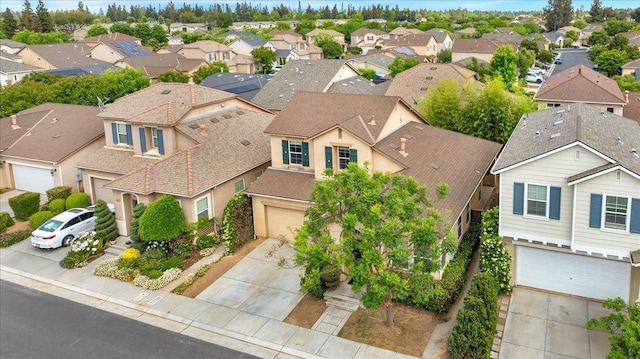 birds eye view of property with a residential view