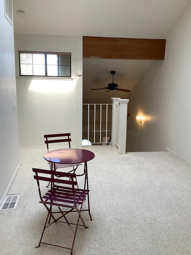 interior space featuring baseboards, visible vents, and ceiling fan