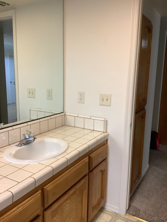 bathroom featuring vanity and visible vents