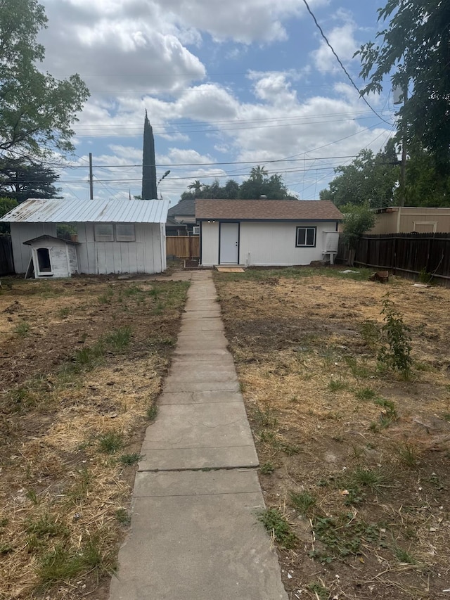 220 S K, Madera, CA 93637 - back of house with an outbuilding and fence