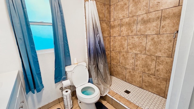 full bathroom with toilet and a stall shower