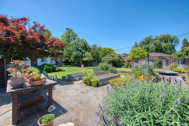 view of yard featuring a garden and fence