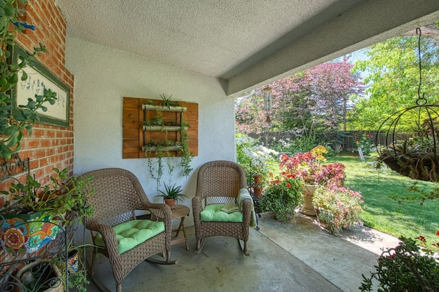 view of patio / terrace featuring fence