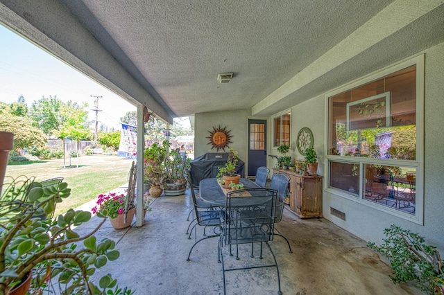 view of patio featuring area for grilling and outdoor dining space