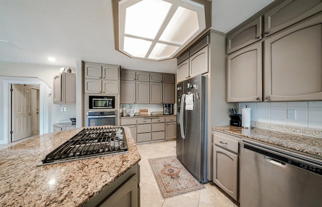 8164 N 8th St, Fresno, CA 93720 - kitchen with appliances with stainless steel finishes, tasteful backsplash, gray cabinetry, and recessed lighting