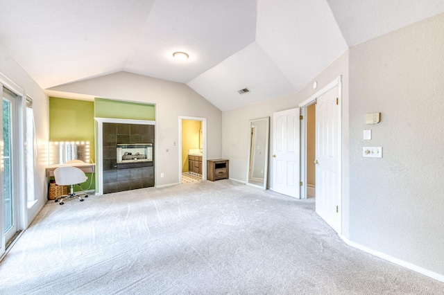 8164 N 8th St, Fresno, CA 93720 - unfurnished living room featuring carpet flooring, vaulted ceiling, baseboards, and a textured wall