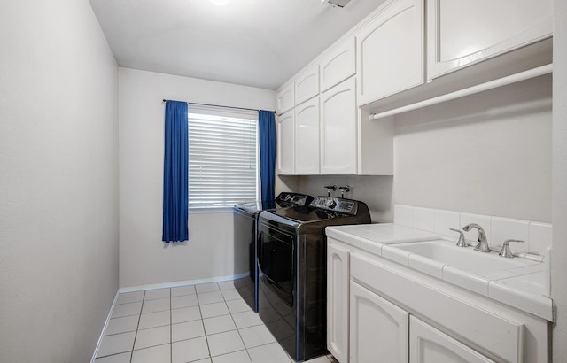 8164 N 8th St, Fresno, CA 93720 - laundry room featuring independent washer and dryer, light tile patterned floors, baseboards, a sink, and cabinet space