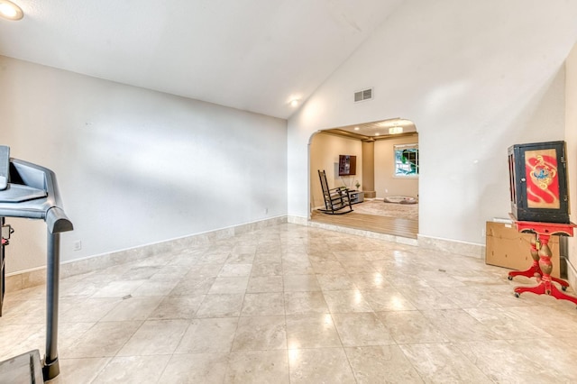 8164 N 8th St, Fresno, CA 93720 - interior space featuring arched walkways, high vaulted ceiling, and baseboards