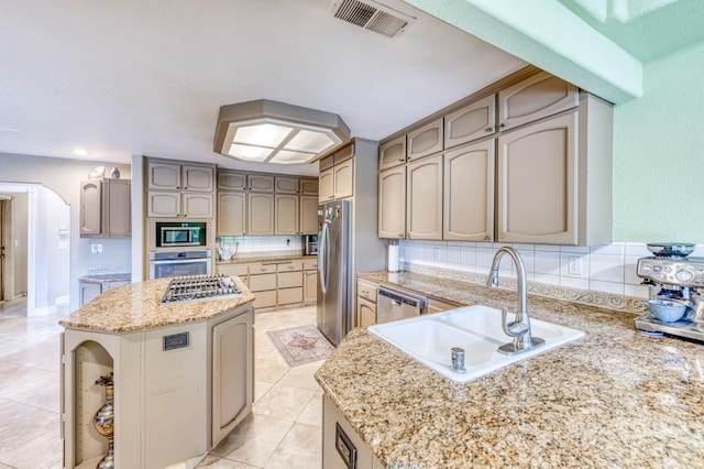 8164 N 8th St, Fresno, CA 93720 - kitchen with a center island, light tile patterned flooring, visible vents, a sink, and stainless steel appliances