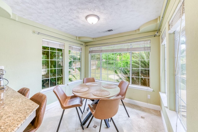 8164 N 8th St, Fresno, CA 93720 - sunroom / solarium with a textured ceiling, tile patterned flooring, visible vents, and plenty of natural light