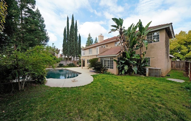 8164 N 8th St, Fresno, CA 93720 - exterior space featuring a lawn, a fenced in pool, cooling unit, stucco siding, and a fenced backyard