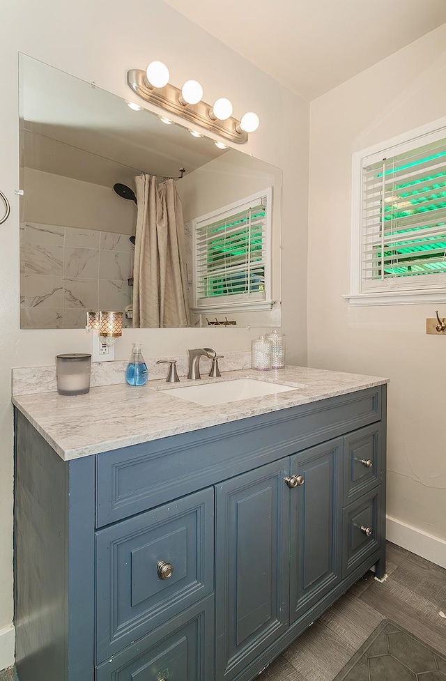 528 W Yale Ave, Fresno, CA 93705 - bathroom with vanity and baseboards