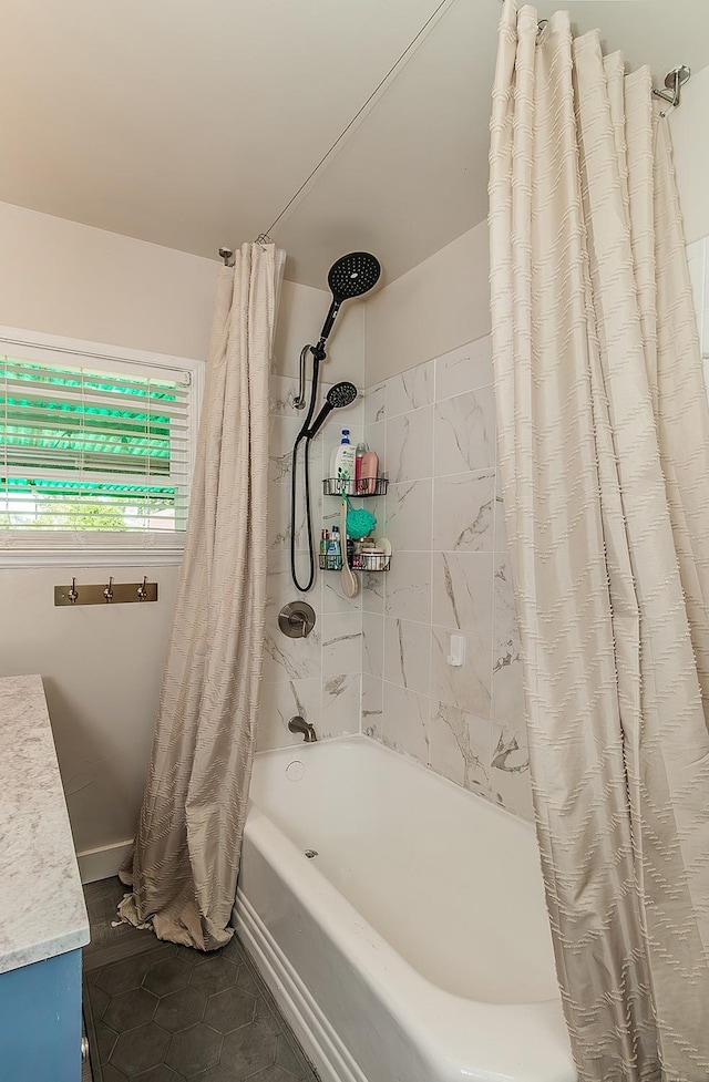 528 W Yale Ave, Fresno, CA 93705 - bathroom with vanity, tile patterned floors, and shower / bath combo