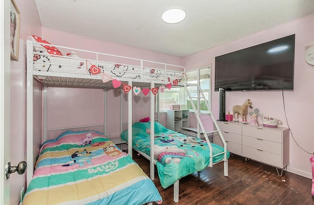 528 W Yale Ave, Fresno, CA 93705 - bedroom featuring hardwood / wood-style flooring and a textured ceiling