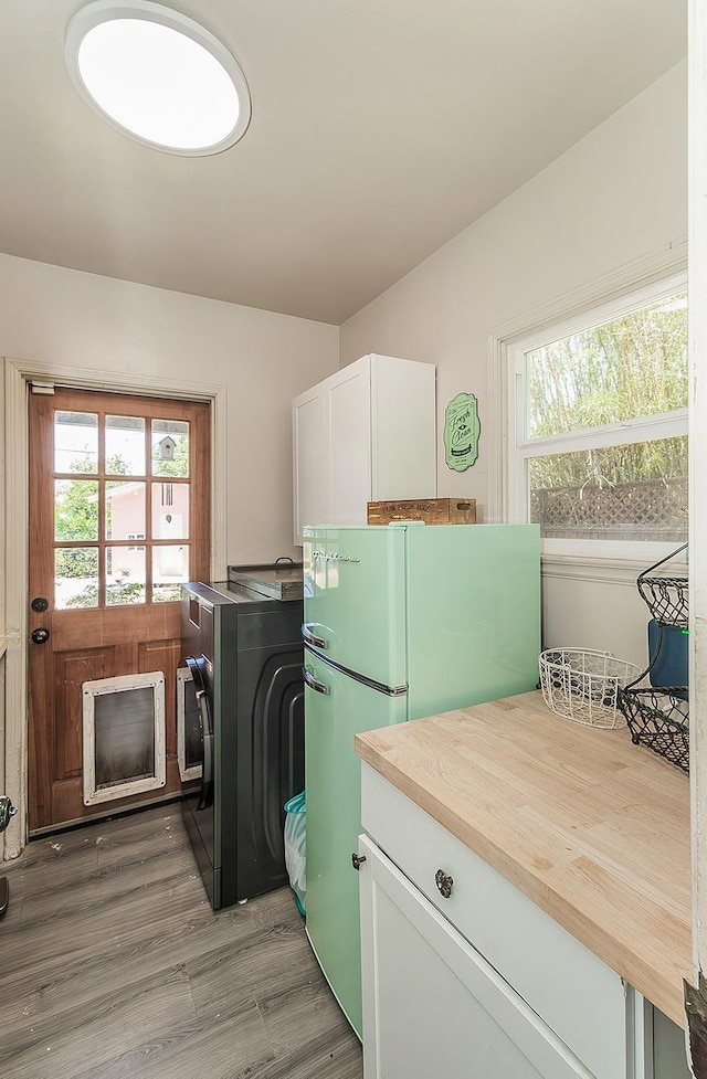 528 W Yale Ave, Fresno, CA 93705 - laundry area with light wood finished floors and laundry area