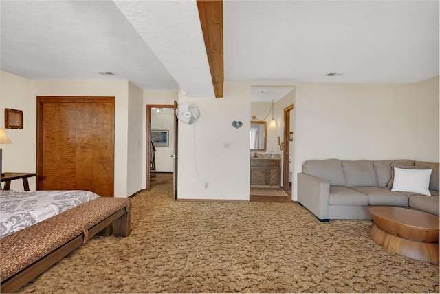 39090 Woodland Rd, Shaver Lake, CA 93664 - carpeted bedroom with a closet, baseboards, and ensuite bath
