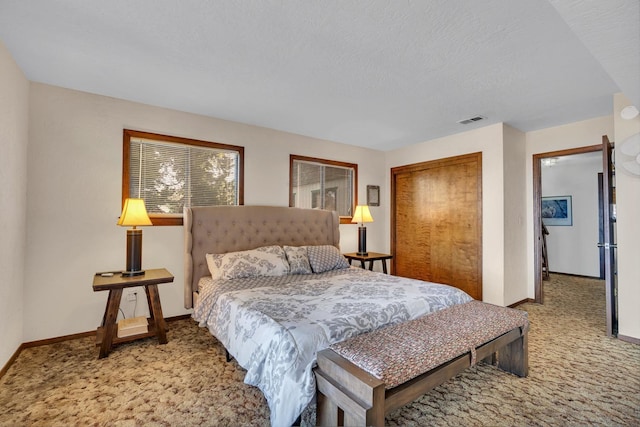 39090 Woodland Rd, Shaver Lake, CA 93664 - carpeted bedroom featuring baseboards, a closet, and a textured ceiling