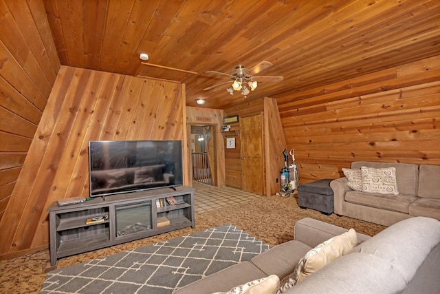 39090 Woodland Rd, Shaver Lake, CA 93664 - living room with wood ceiling, wood walls, a ceiling fan, and carpet flooring