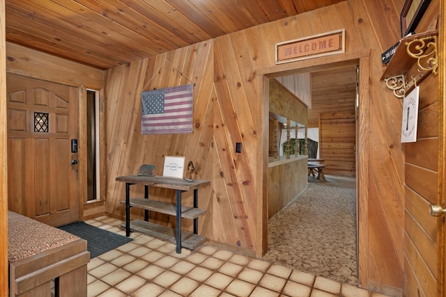 39090 Woodland Rd, Shaver Lake, CA 93664 - foyer entrance featuring wood walls and wood ceiling