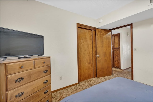 39090 Woodland Rd, Shaver Lake, CA 93664 - bedroom with baseboards, a closet, and light carpet
