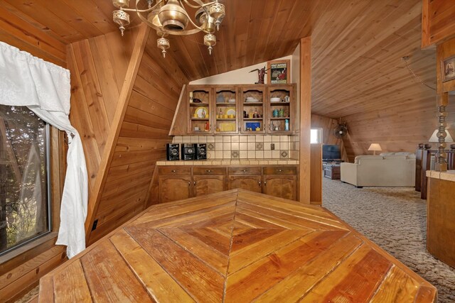 39090 Woodland Rd, Shaver Lake, CA 93664 - bonus room with vaulted ceiling, wooden walls, wood ceiling, a chandelier, and carpet