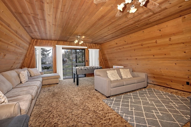 39090 Woodland Rd, Shaver Lake, CA 93664 - carpeted living area with a ceiling fan, wooden walls, and wood ceiling