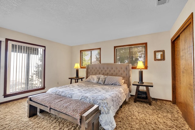 39090 Woodland Rd, Shaver Lake, CA 93664 - carpeted bedroom with baseboards and a textured ceiling