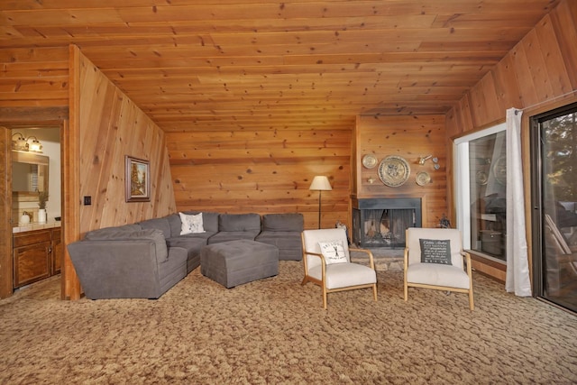 39090 Woodland Rd, Shaver Lake, CA 93664 - living room with wood walls, wooden ceiling, carpet flooring, and a fireplace