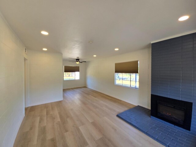 155 E Hampton Way, Fresno, CA 93704 - unfurnished living room with a large fireplace, light wood-style flooring, and recessed lighting