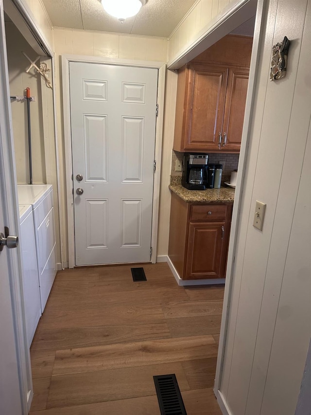 7676 N Fresno St Unit Sp 20, Fresno, CA 93720 - laundry room featuring washer and clothes dryer and wood finished floors
