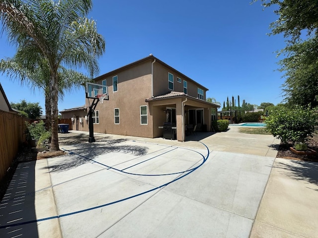 1885 N Whitehorse, Clovis, CA 93619 - view of sport court with a fenced in pool, fence, and community basketball court