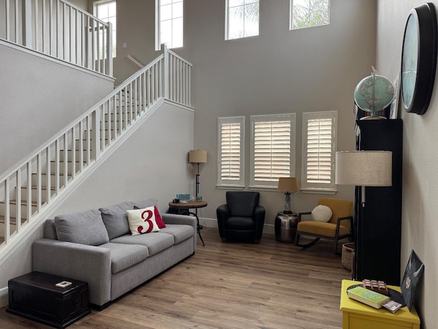 1885 N Whitehorse, Clovis, CA 93619 - living area featuring stairway, wood finished floors, and a high ceiling
