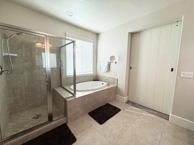 1885 N Whitehorse, Clovis, CA 93619 - bathroom featuring tile patterned floors, a garden tub, baseboards, and a shower stall