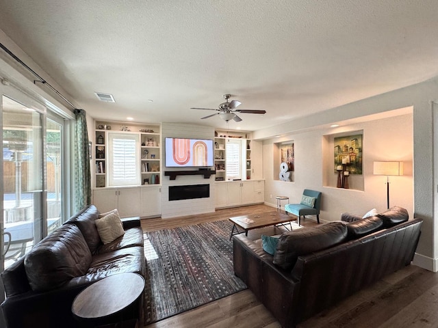 1885 N Whitehorse, Clovis, CA 93619 - living room with ceiling fan, a textured ceiling, visible vents, and wood finished floors
