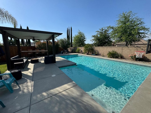 1885 N Whitehorse, Clovis, CA 93619 - view of swimming pool featuring a ceiling fan, a patio area, a fenced in pool, and a fenced backyard