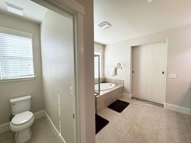 1885 N Whitehorse, Clovis, CA 93619 - full bathroom with toilet, a garden tub, baseboards, and visible vents