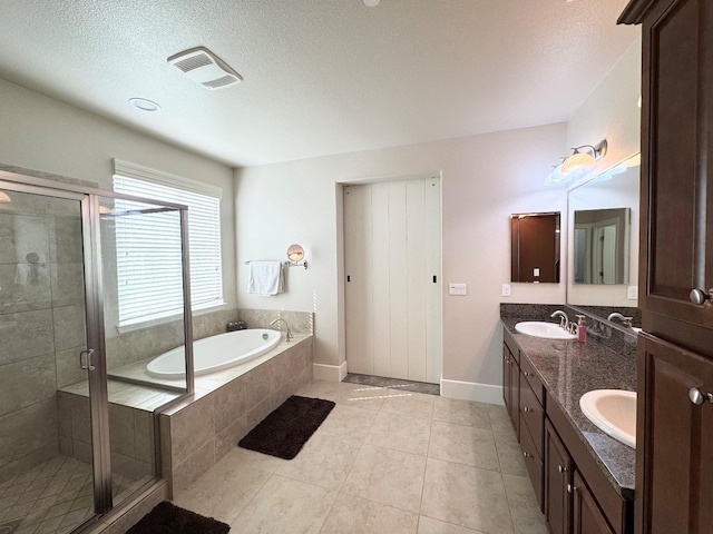 1885 N Whitehorse, Clovis, CA 93619 - bathroom featuring a sink, visible vents, a stall shower, double vanity, and a garden tub