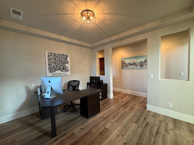 1885 N Whitehorse, Clovis, CA 93619 - home office with visible vents, wood finished floors, and baseboards