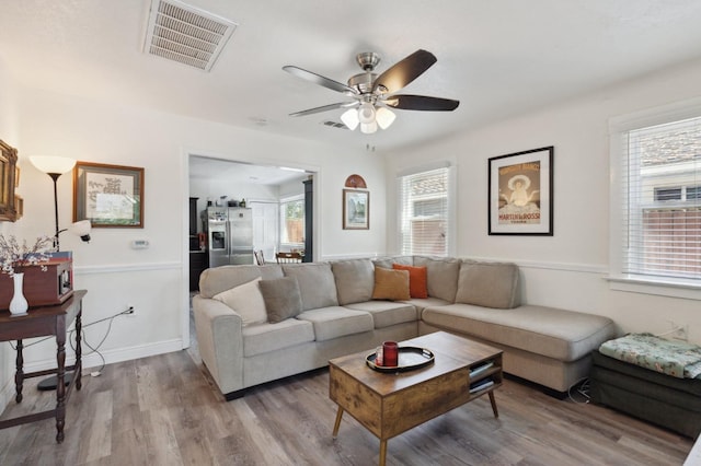 1568 N Glenn Ave, Fresno, CA 93728 - living room with ceiling fan and wood finished floors